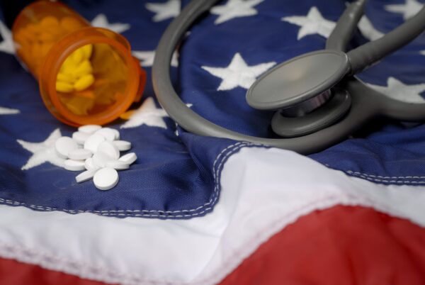 A stethoscope and medication on an American flag.